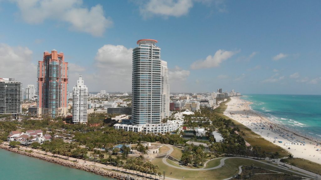 Condominium towers standing at the water's edge at South Pointe, open ocean on one side and the shipping channel on the other